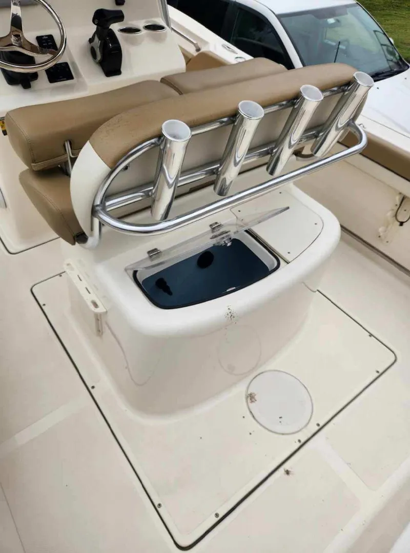 Slide: The Image of 2019 Pioneer 222 Sportfish boat with rod holders and seating area. - 20