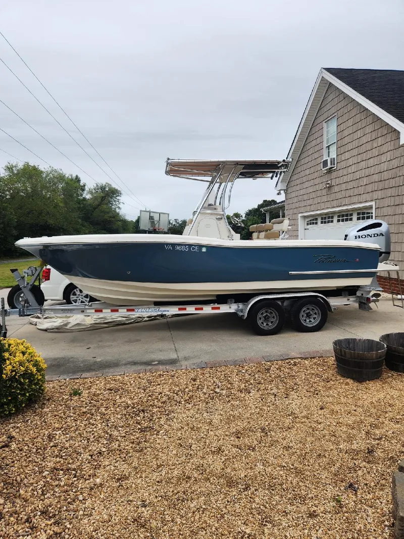 Slide: The Image of 2019 Pioneer 222 Sportfish boat on trailer, parked in driveway near house. - 3