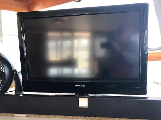 Slide: The Image of Flat-screen TV inside 1988 Bayliner 3818 Motoryacht cabin. - 17