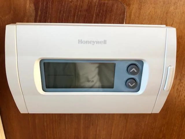 Slide: The Image of Honeywell thermostat on 1988 Bayliner 3818 Motoryacht wooden interior. - 19