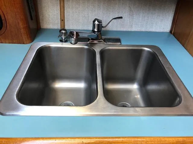 Slide: The Image of Stainless steel double sink in 1988 Bayliner 3818 Motoryacht kitchen area. - 31