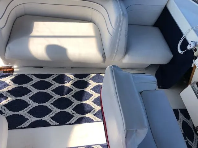 Slide: The Image of Interior of 1988 Bayliner 3818 Motoryacht with cushioned seating and patterned carpet. - 8