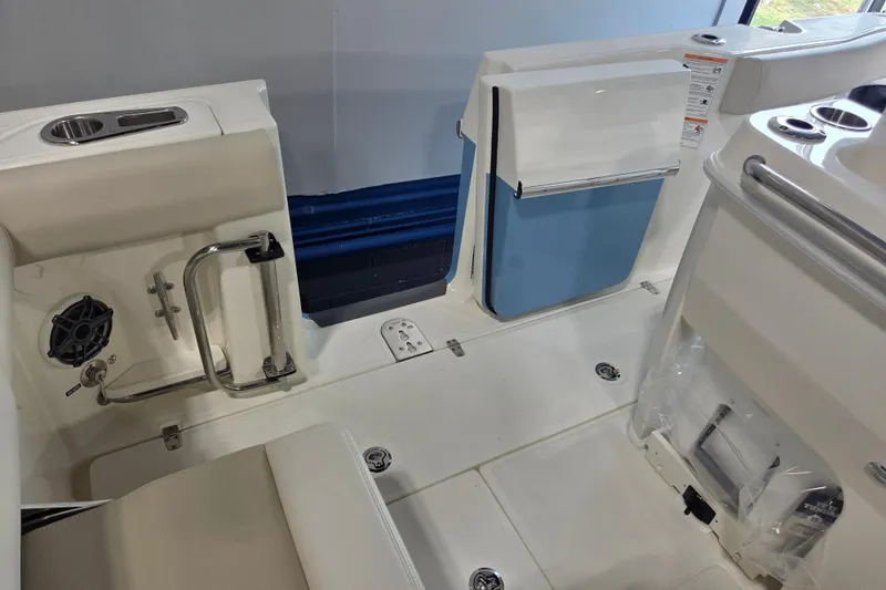 Slide: The Image of 2026 Boston Whaler 280 Outrage interior, featuring seating and storage compartments. - 12