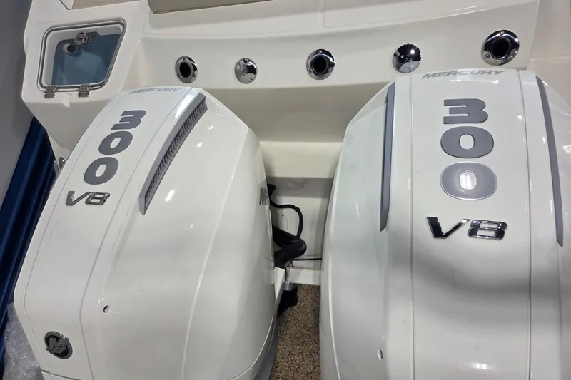 Slide: The Image of Twin Mercury 300 V8 engines on a 2026 Boston Whaler 280 Outrage boat. - 6