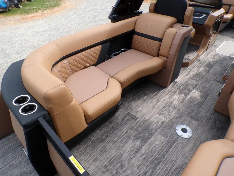 Slide: The Image of Luxurious seating on 2025 Godfrey AquaPatio 235 SBW iMPACT pontoon boat, featuring elegant design. - 2