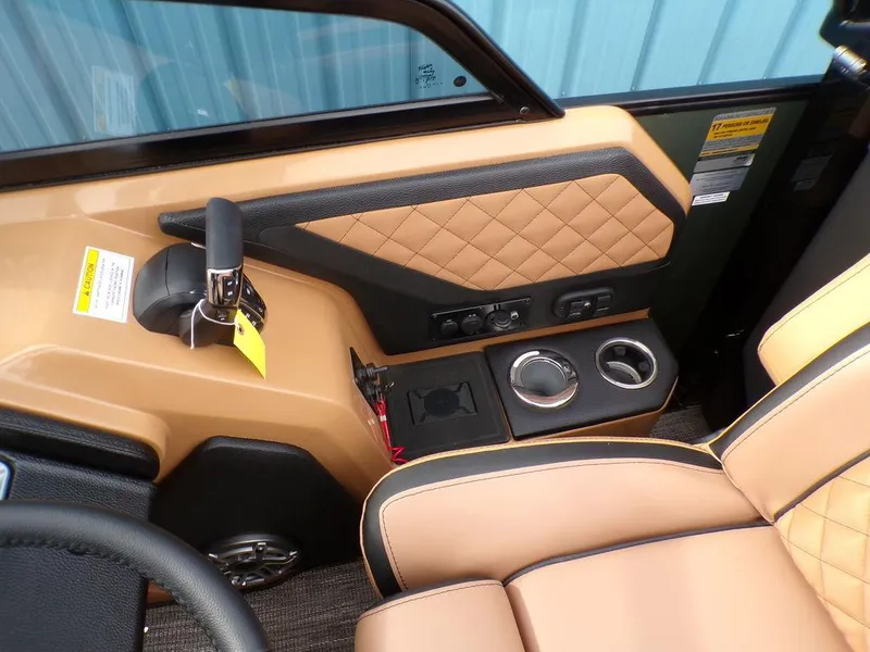 Slide: The Image of 2025 Godfrey AquaPatio 235 SBW helm with tan quilted seats and control panel. - 6