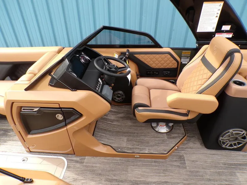 Slide: The Image of Luxurious interior of 2025 Godfrey AquaPatio 235 SBW boat with tan seating and modern dashboard. - 8