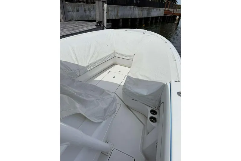 Slide: The Image of 2012 Intrepid 32 Open boat interior with white seating and deck. - 4
