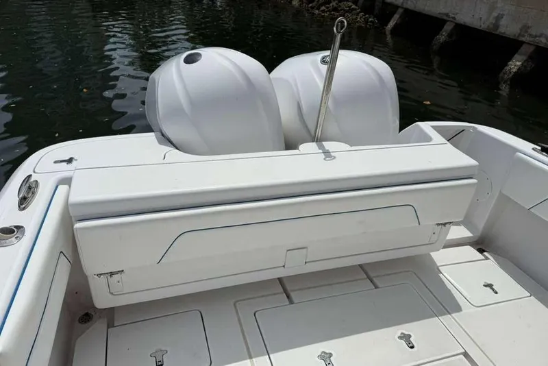 Slide: The Image of 2012 Intrepid 32 Open boat with dual engines, featuring a spacious deck and seating area. - 5