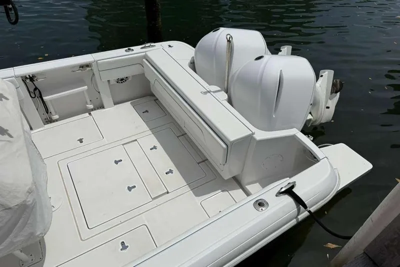 Slide: The Image of 2012 Intrepid 32 Open boat with dual engines docked on calm water. - 7