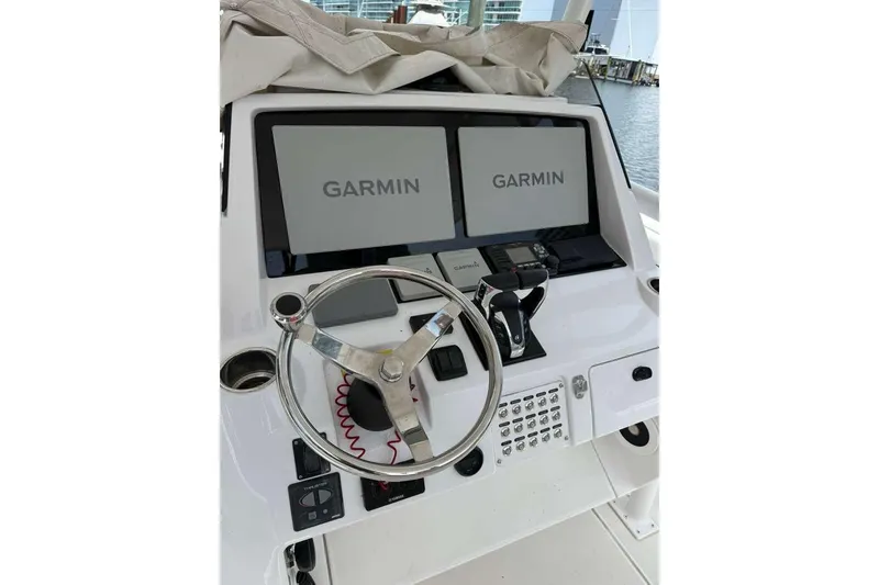 Slide: The Image of 2012 Intrepid 32 Open boat helm with Garmin navigation displays. - 8
