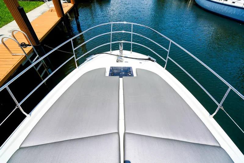 Slide: The Image of Bow view of 2017 Azimut 42 Fly yacht with sunbathing cushions. - 25