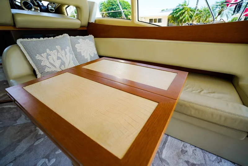 Slide: The Image of Luxurious interior of 2017 Azimut 42 Fly yacht with elegant seating and wooden table. - 29