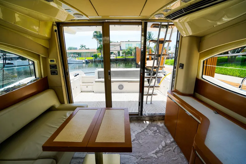 Slide: The Image of Interior view of 2017 Azimut 42 Fly yacht with elegant seating and outdoor access. - 31