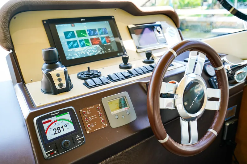 Slide: The Image of Cockpit of 2017 Azimut 42 Fly yacht with advanced navigation controls and steering wheel. - 35