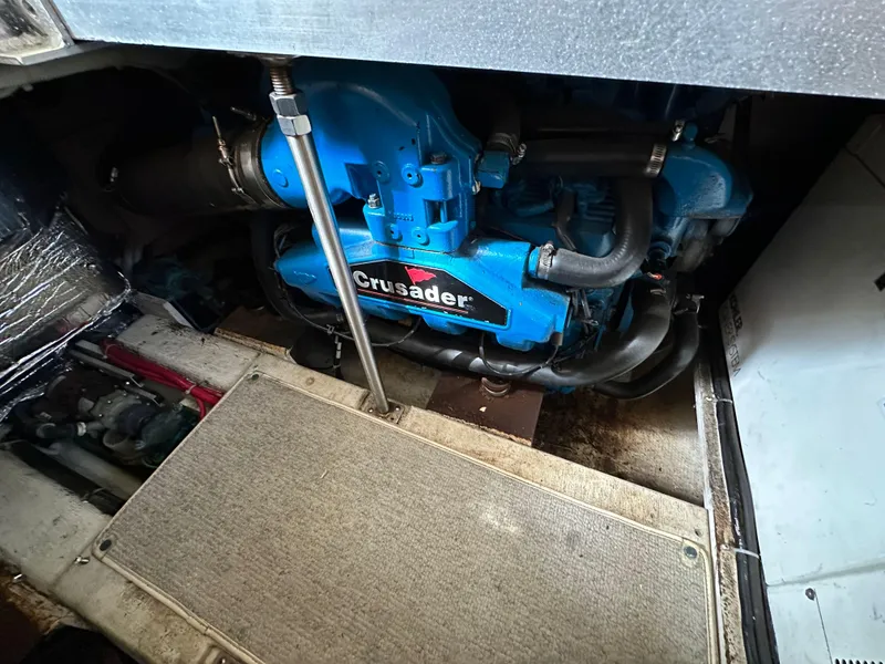 Slide: The Image of Engine compartment of 2002 Carver AFT CABIN with Crusader engine visible. - 14