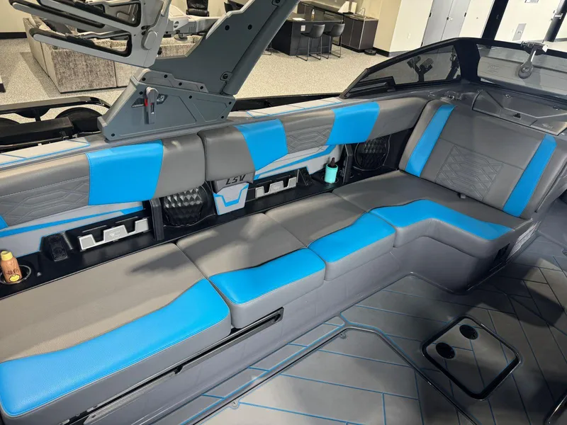 Slide: The Image of Interior of 2022 Malibu Wakesetter 25 LSV with blue and gray seating. - 17