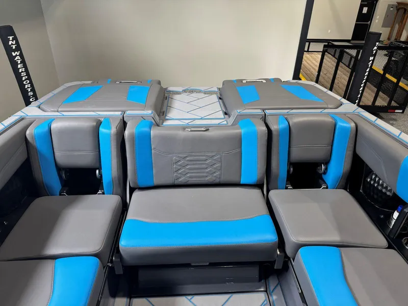 Slide: The Image of 2022 Malibu Wakesetter 25 LSV interior with blue and gray seating. - 18