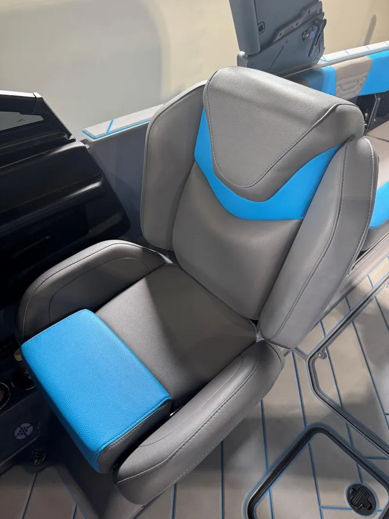 Slide: The Image of 2022 Malibu Wakesetter 25 LSV seat, gray and blue design, modern boat interior. - 32