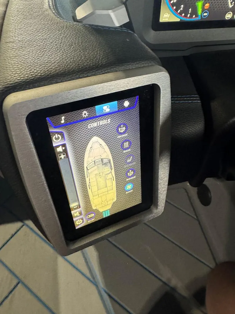 Slide: The Image of Touchscreen control panel in 2022 Malibu Wakesetter 25 LSV boat cockpit. - 36