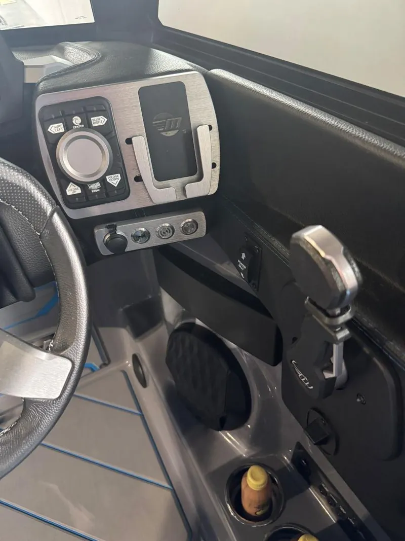 Slide: The Image of Interior dashboard of 2022 Malibu Wakesetter 25 LSV boat with control panel. - 37