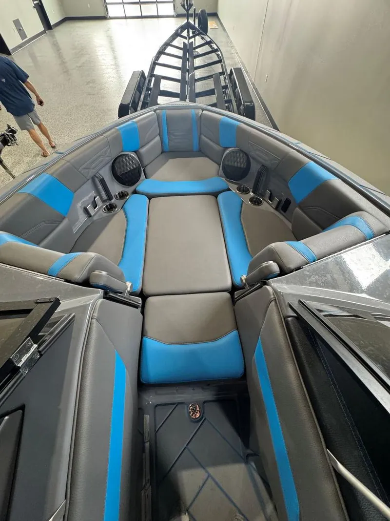 Slide: The Image of 2022 Malibu Wakesetter 25 LSV interior with blue and gray seating. - 42