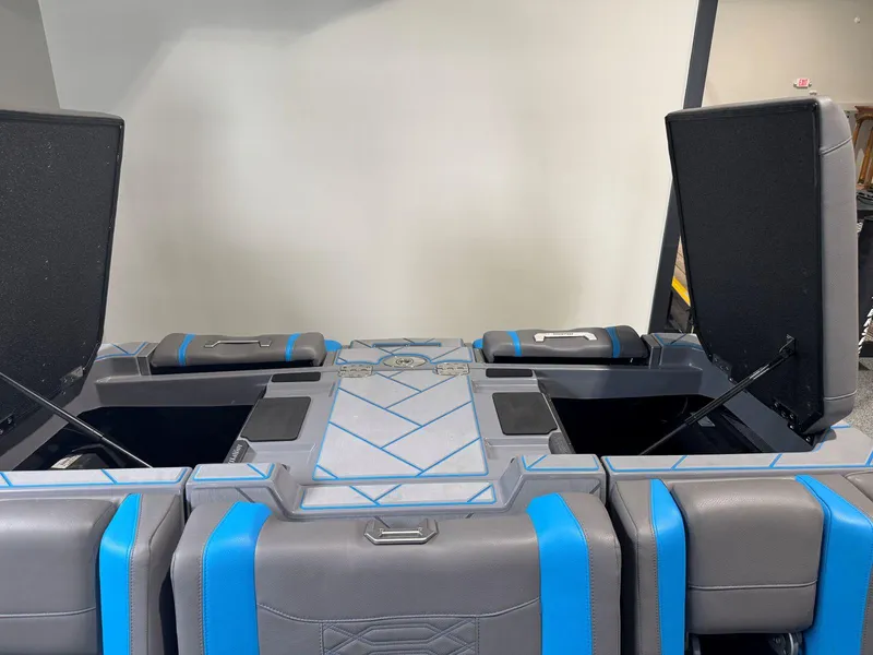 Slide: The Image of 2022 Malibu Wakesetter 25 LSV interior storage compartments with blue accents. - 43