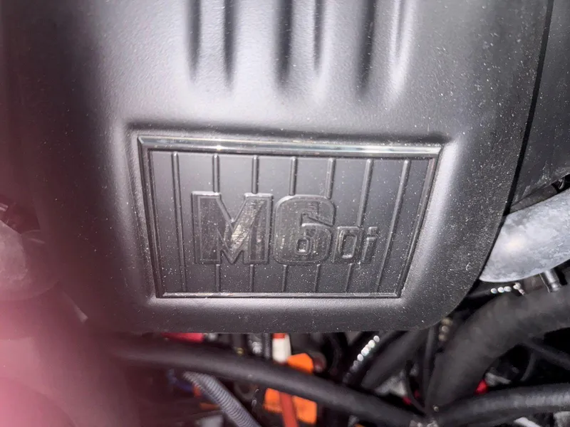 Slide: The Image of Engine cover of 2022 Malibu Wakesetter 25 LSV with M6Di branding. - 46