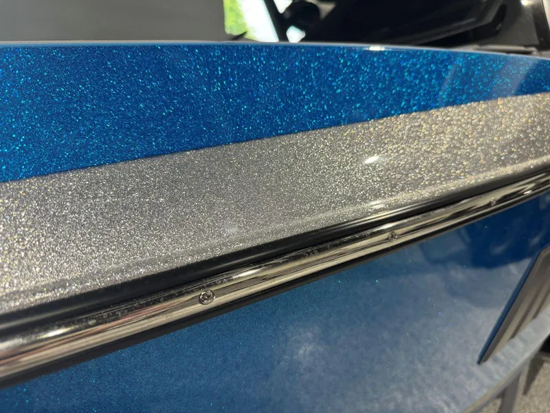 Slide: The Image of 2022 Malibu Wakesetter 25 LSV boat with sparkling blue and silver finish. - 47