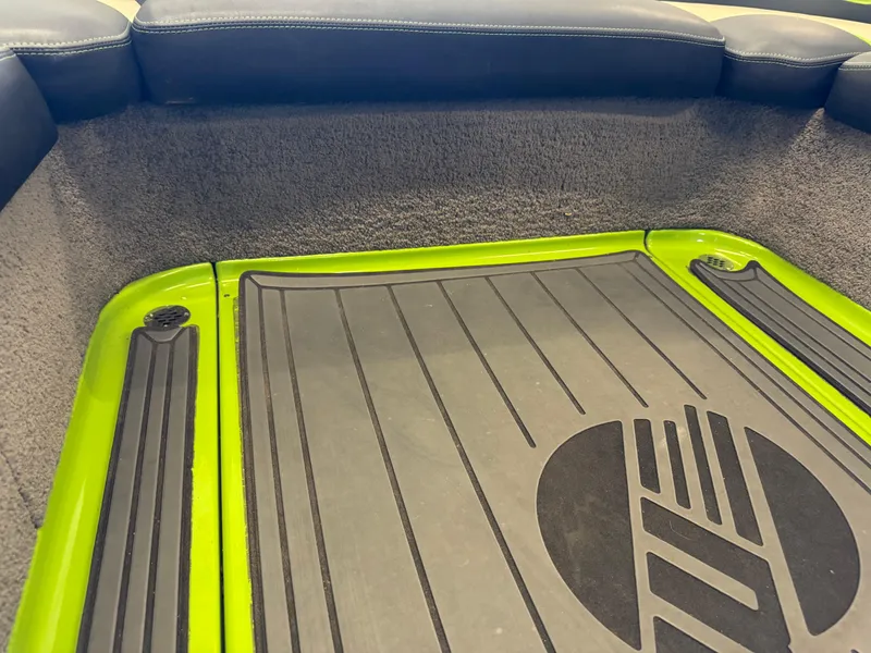 Slide: The Image of Interior of 2016 Malibu Wakesetter 23 LSV with green and black flooring. - 13