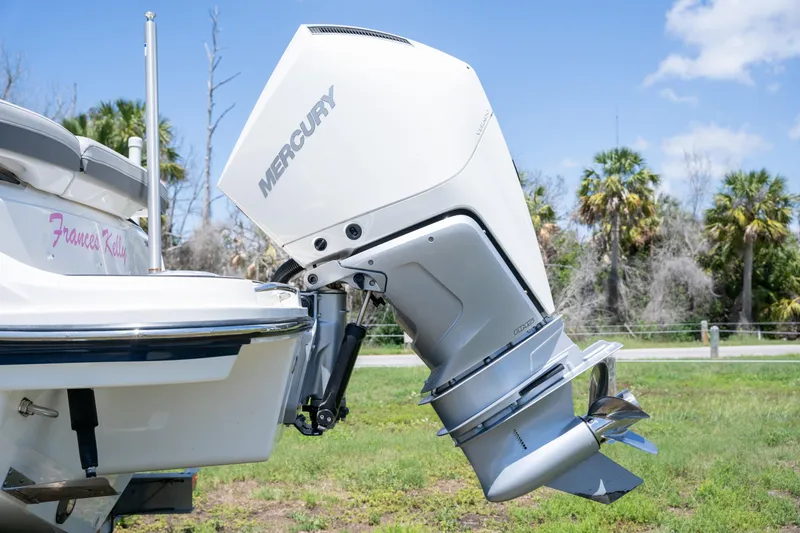 Slide: The Image of 2023 Sea Ray SLX 260 Outboard with Mercury engine, displayed outdoors. - 10