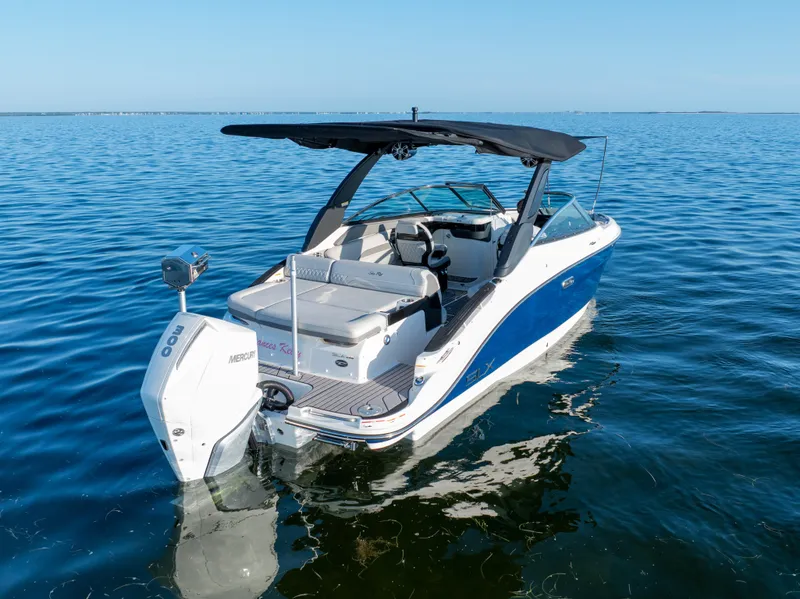 Slide: The Image of 2023 Sea Ray SLX 260 Outboard boat on calm water, featuring sleek design and modern amenities. - 14
