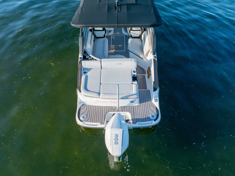 Slide: The Image of 2023 Sea Ray SLX 260 Outboard boat on water, aerial view. - 23