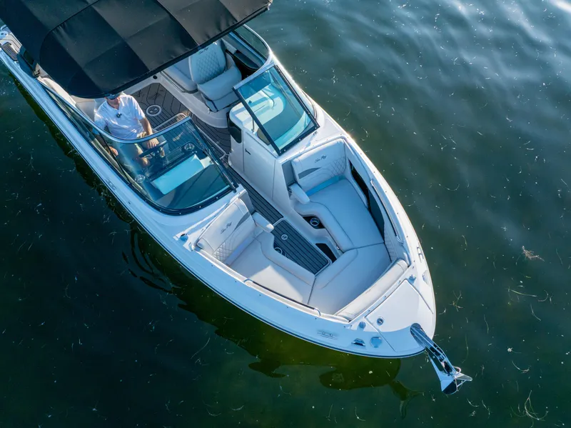 Slide: The Image of 2023 Sea Ray SLX 260 Outboard boat on calm water, aerial view. - 24