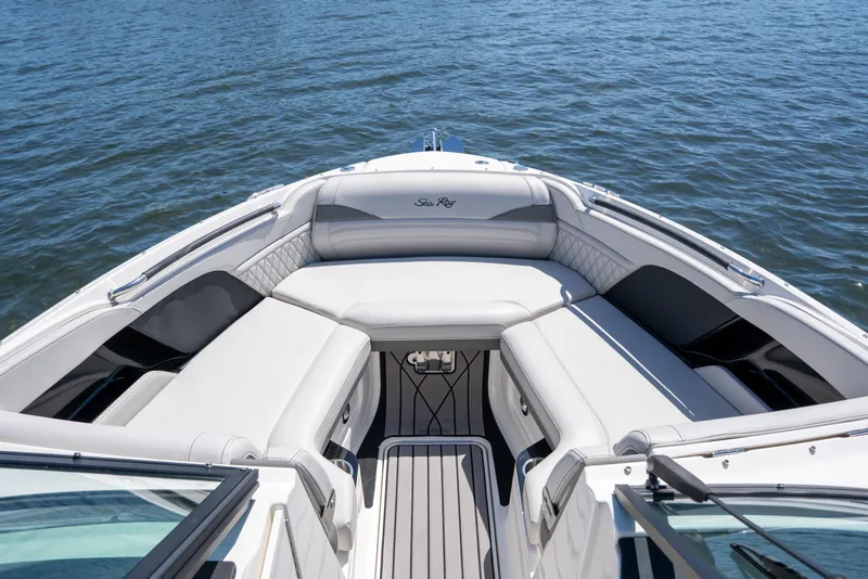 Slide: The Image of 2023 Sea Ray SLX 260 Outboard boat with luxurious seating on calm water. - 34