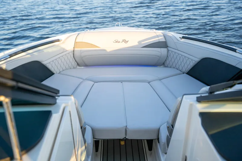 Slide: The Image of 2023 Sea Ray SLX 260 Outboard boat interior with luxurious seating on water. - 35