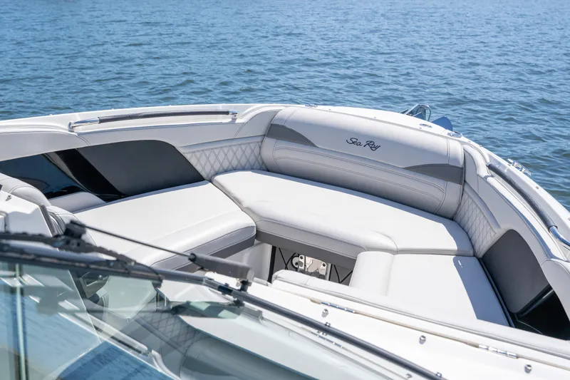 Slide: The Image of 2023 Sea Ray SLX 260 Outboard boat with luxurious seating on calm water. - 38
