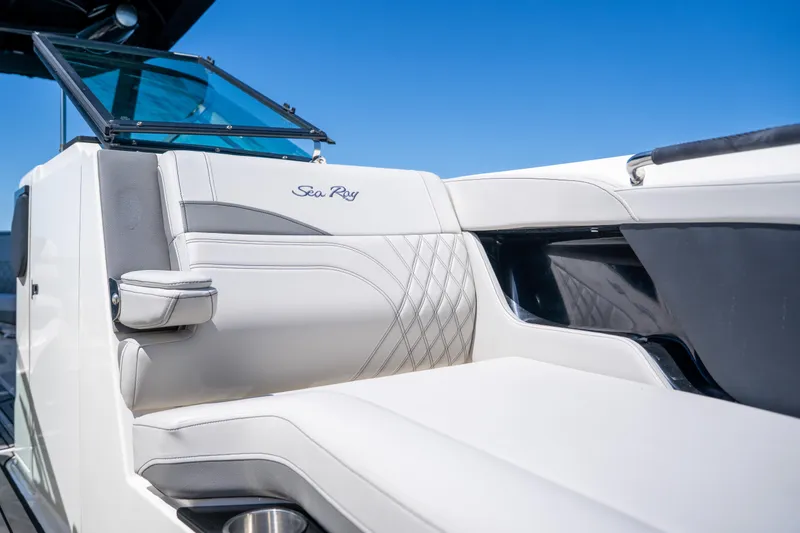 Slide: The Image of 2023 Sea Ray SLX 260 Outboard boat interior with luxurious seating and sleek design. - 40