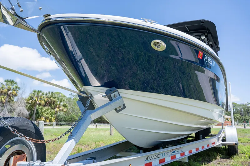 Slide: The Image of 2023 Sea Ray SLX 260 Outboard boat on trailer, side view. - 7