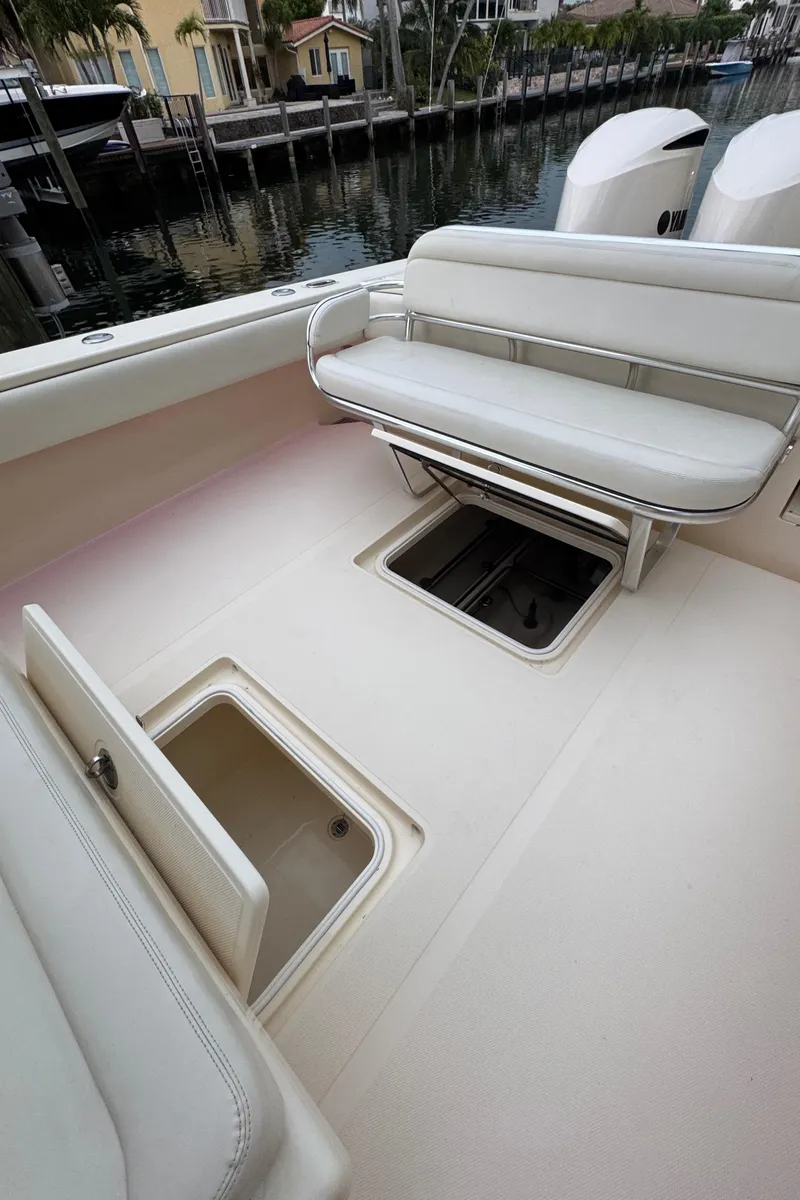 Slide: The Image of 2013 Bahama 41 boat interior with storage compartments and seating. - 5