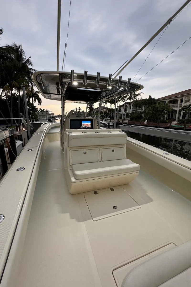Slide: The Image of 2013 Bahama 41 boat with sleek design, spacious deck, and modern console. - 8