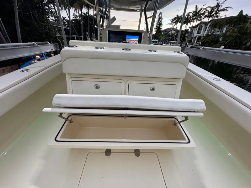 Slide: The Image of 2013 Bahama 41 boat interior with open storage compartment and seating. - 9