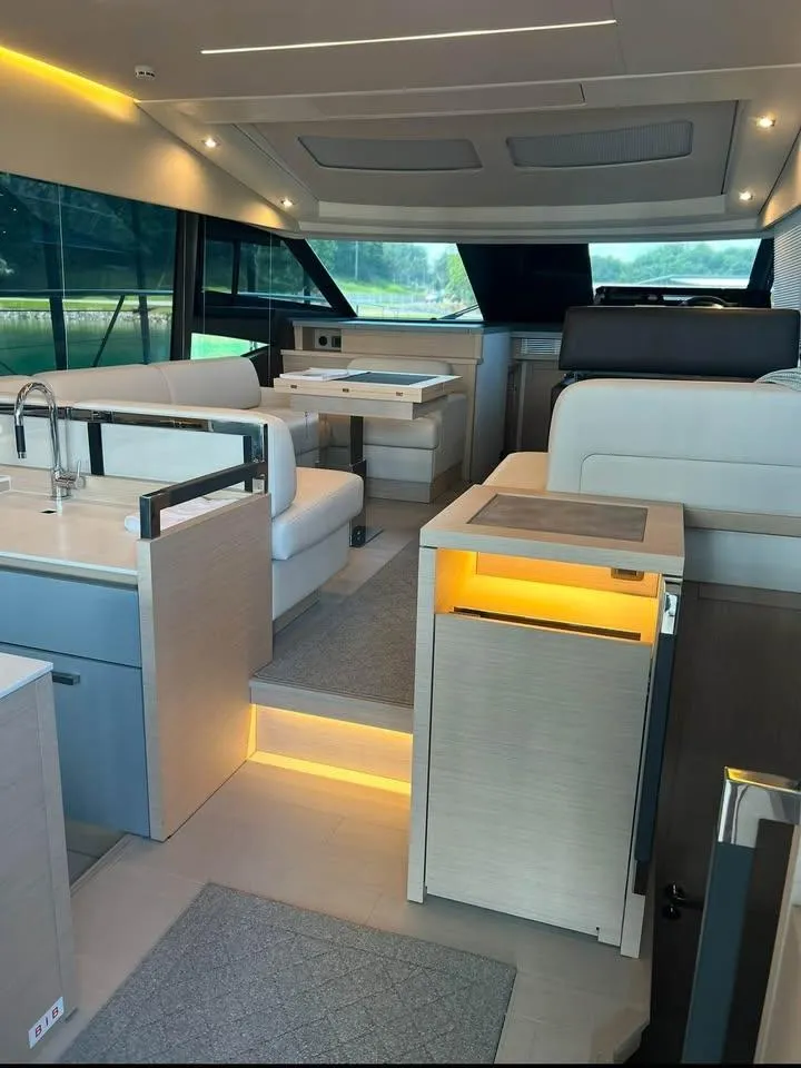 Slide: The Image of Luxurious interior of a 2023 Prestige 520S yacht with modern furnishings and ambient lighting. - 4