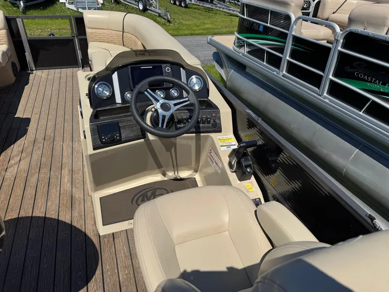 Slide: The Image of 2022 Montego Bay 8522 2PT BK DLX Fish & Cruise boat interior with steering console. - 10