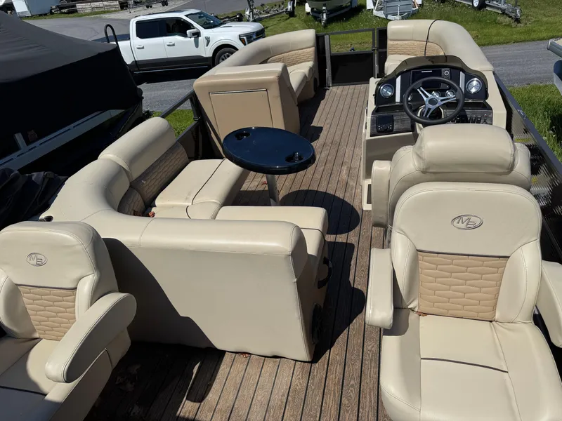 Slide: The Image of 2022 Montego Bay 8522 2PT BK DLX Fish & Cruise pontoon boat interior with beige seating. - 7