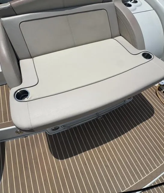 Slide: The Image of 2015 Formula 350 Crossover Bowrider seat with cup holders on teak deck. - 20