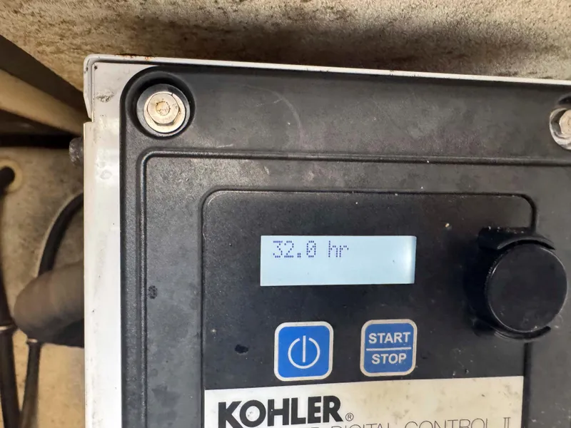 Slide: The Image of Kohler digital control panel displaying 32.8 hours on a Formula 350 Crossover Bowrider, 2015 model. - 31