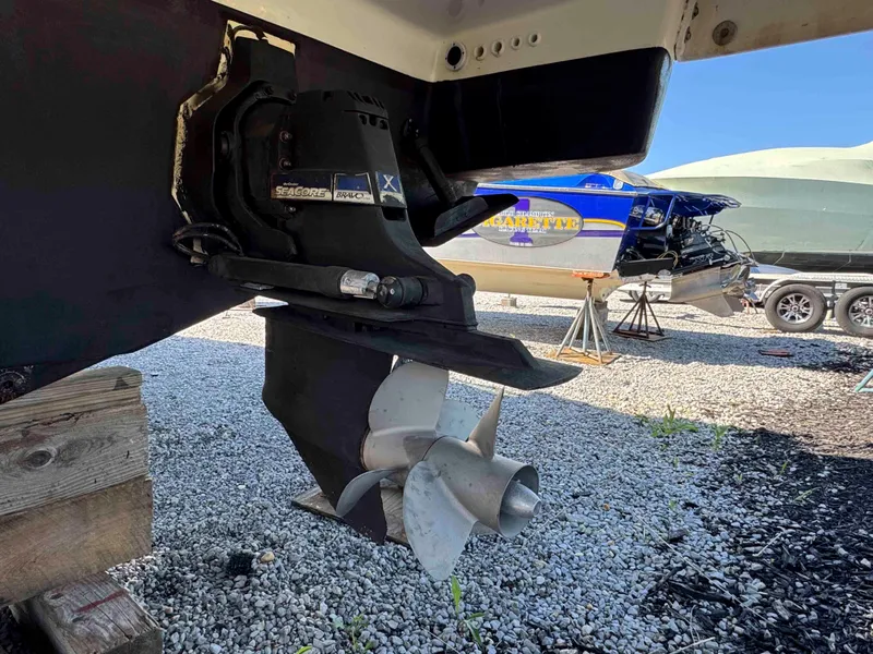 Slide: The Image of 2015 Formula 350 Crossover Bowrider boat propeller and drive system on gravel. - 33