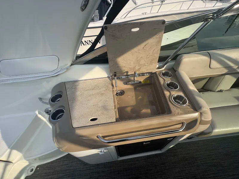 Slide: The Image of 2015 Formula 350 Crossover Bowrider interior with sink and cup holders. - 9