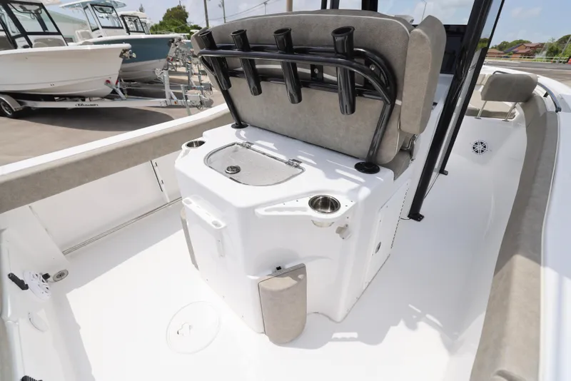 Slide: The Image of 2025 Sea Hunt Ultra 245 SE boat interior with seating and rod holders. - 10